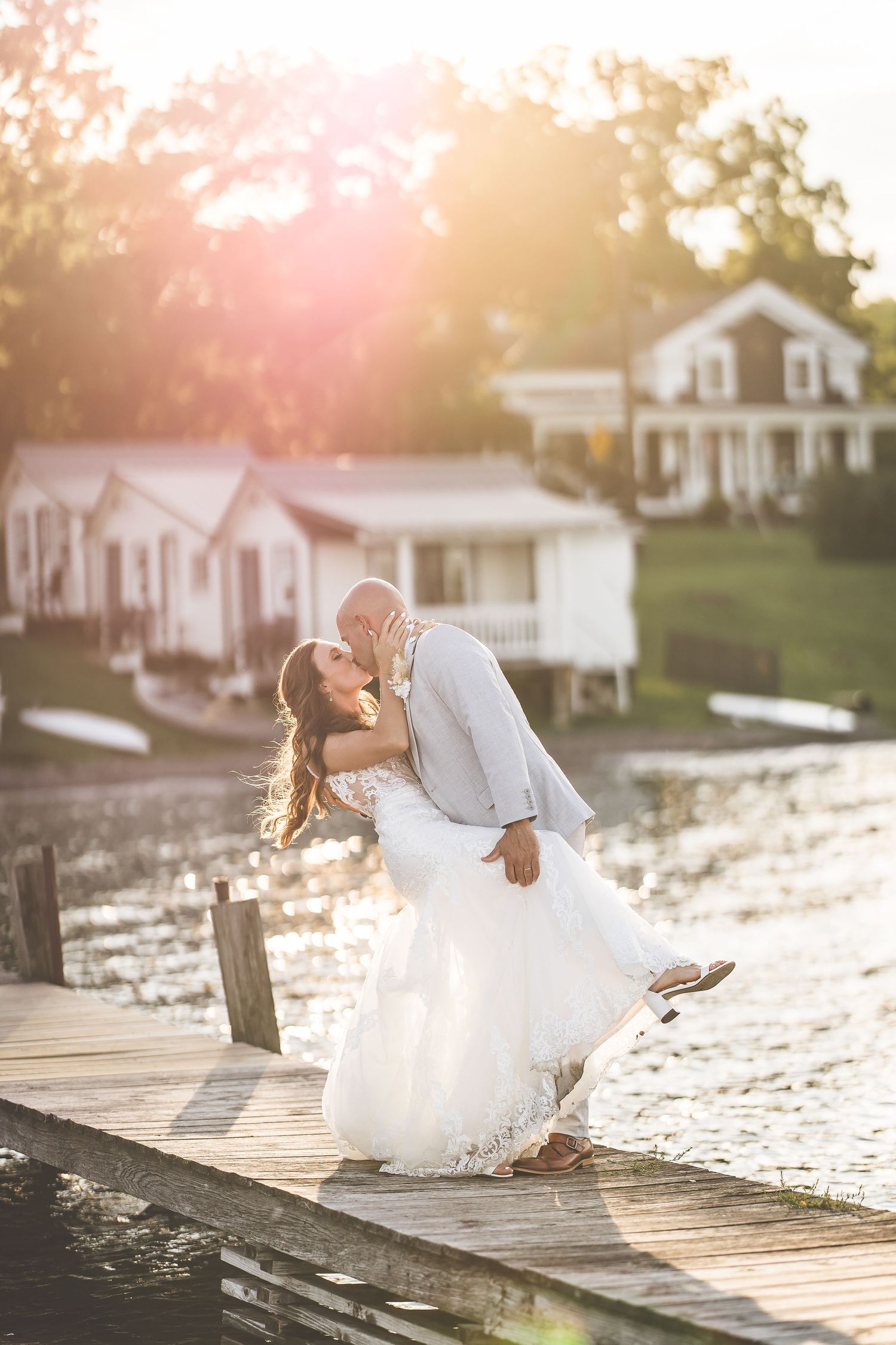 Dreamy waterfront wedding photography sequence with sunlit dock and romantic poses.