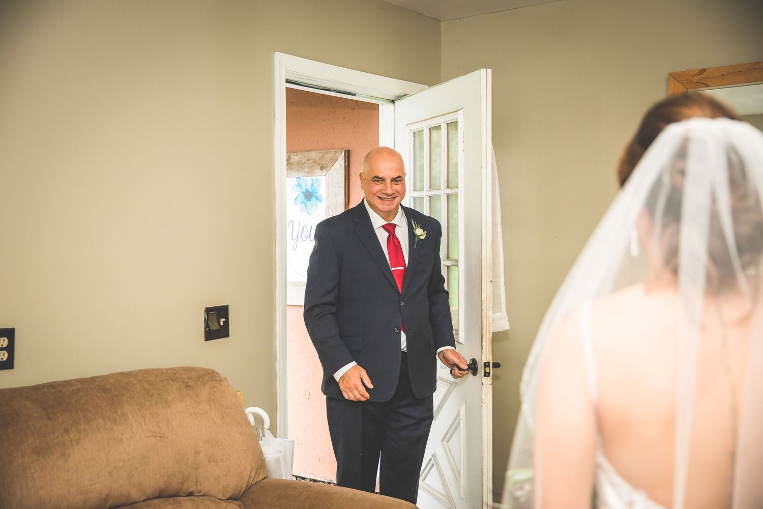 Wedding preparation scene with formal attire in indoor setting.