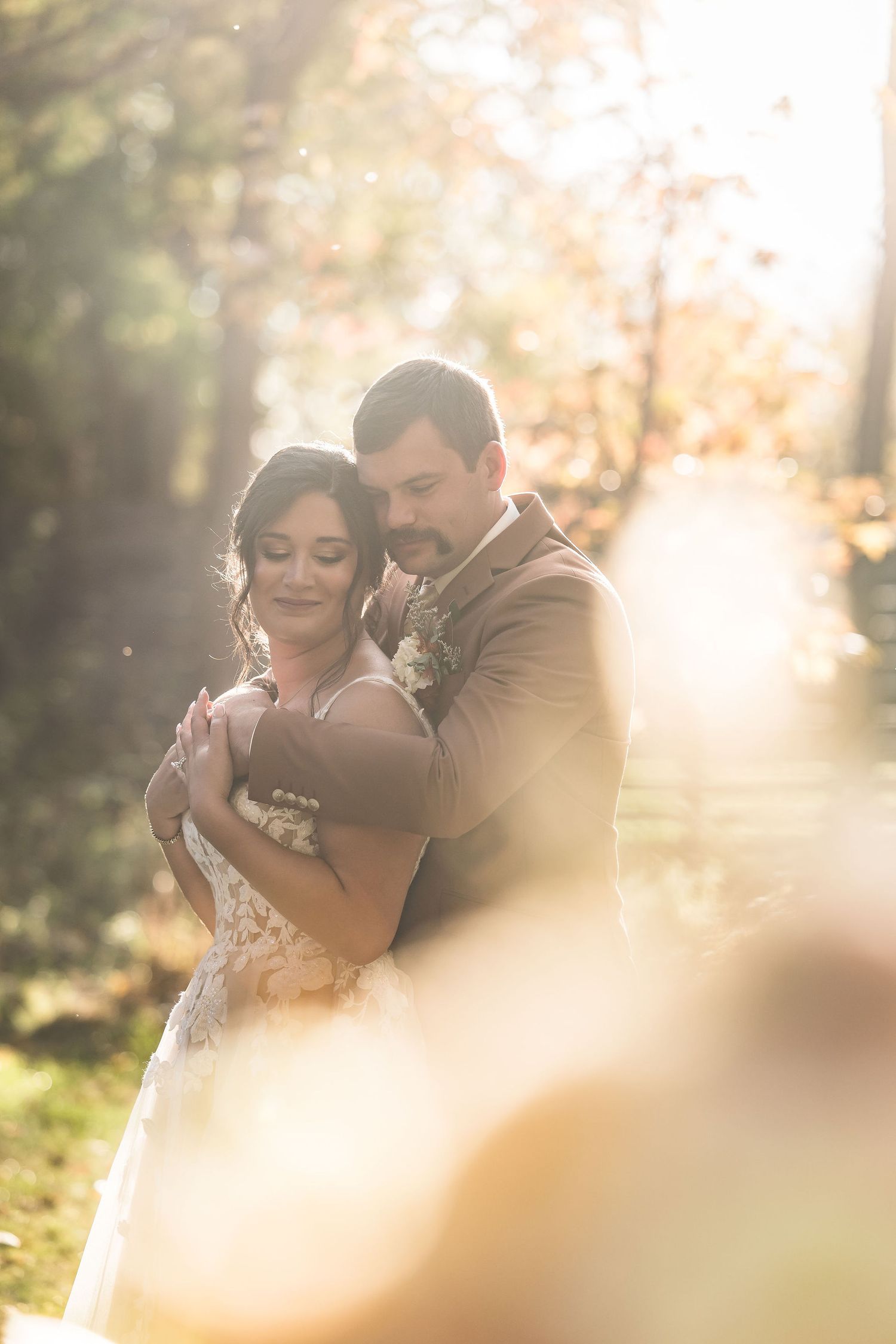 Romantic wedding couple shares intimate embraces during golden hour photography session.