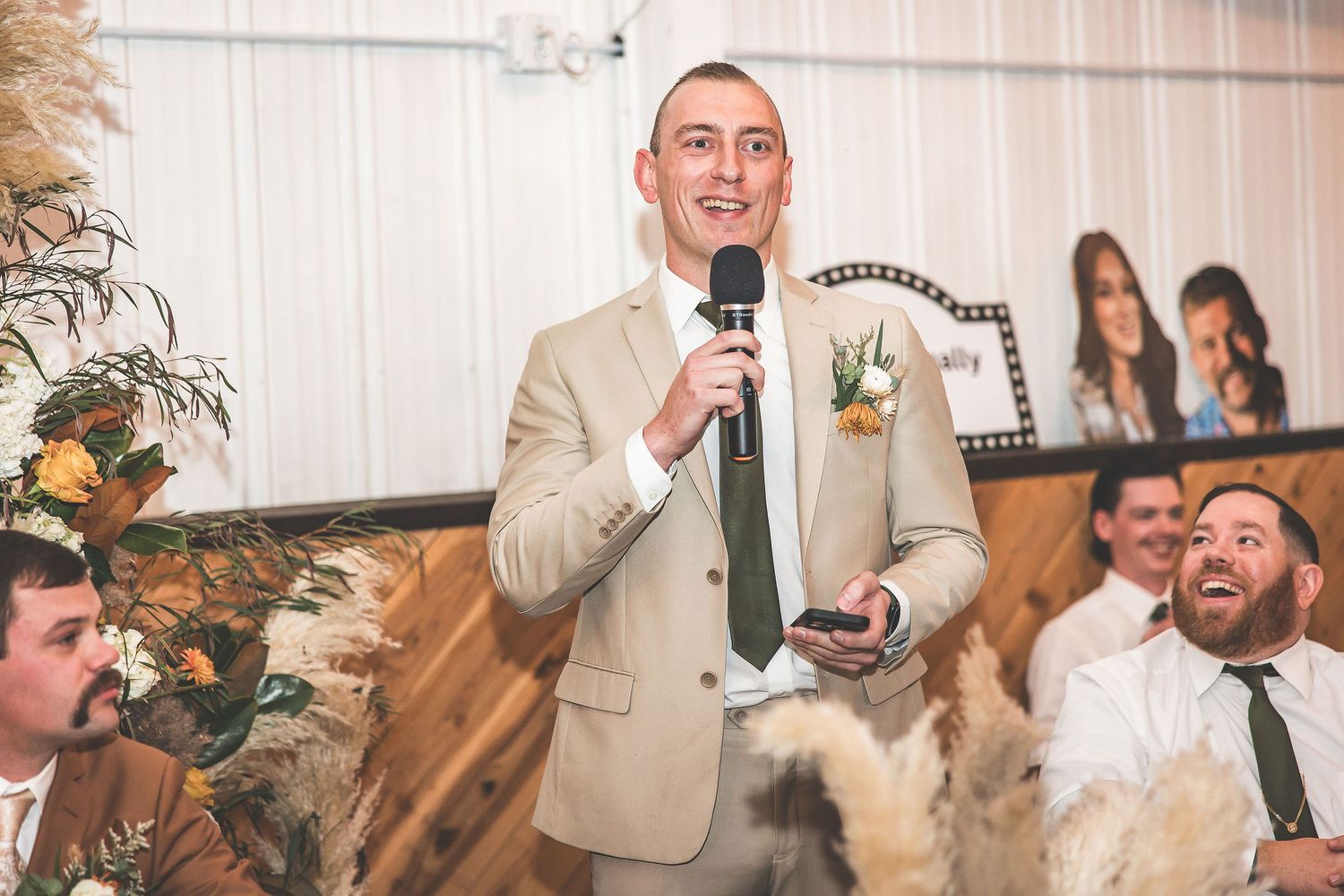 Wedding reception guests share emotional moments during speeches and toasts.