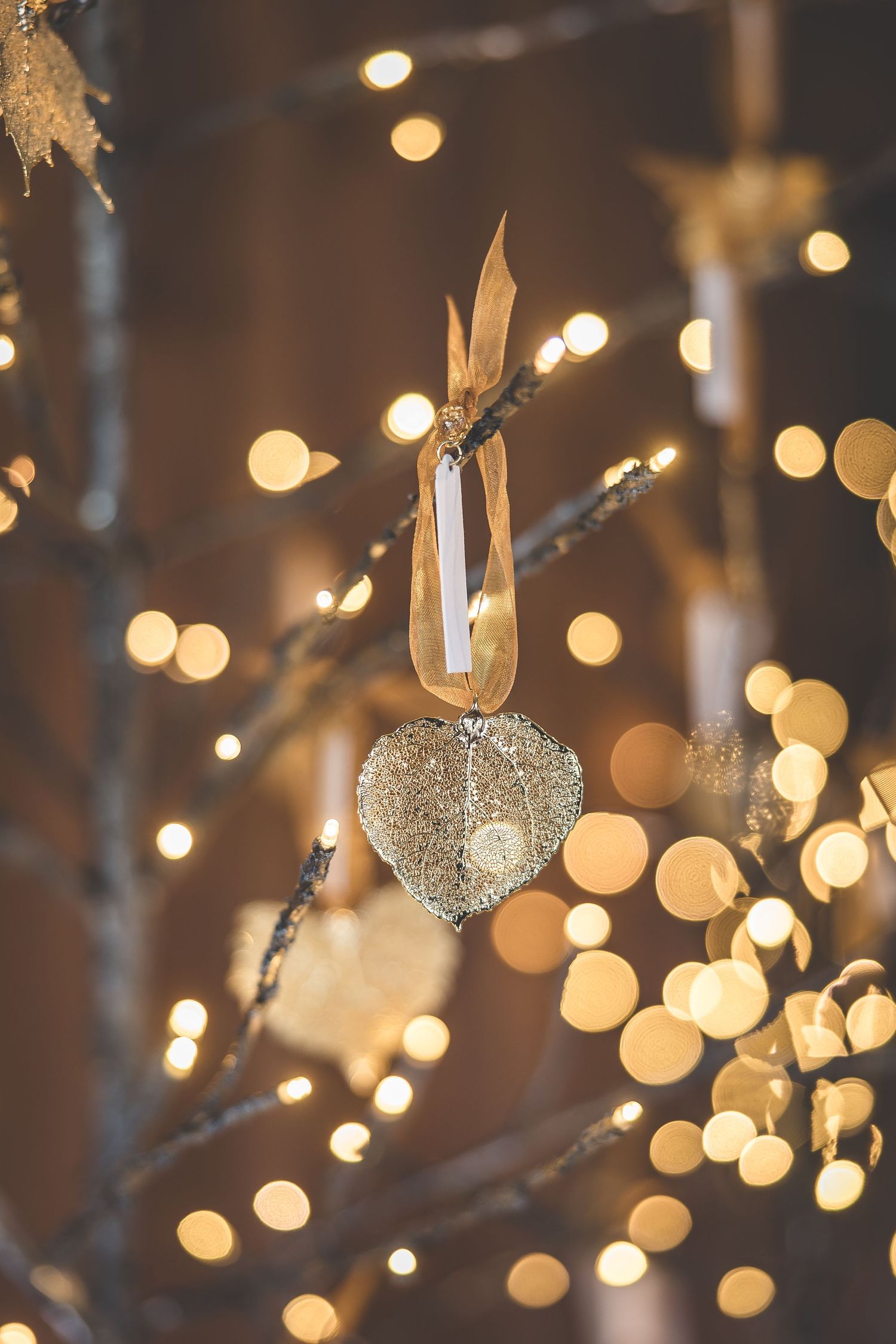 Bokeh lights and decorative elements create a dreamy wedding reception atmosphere.