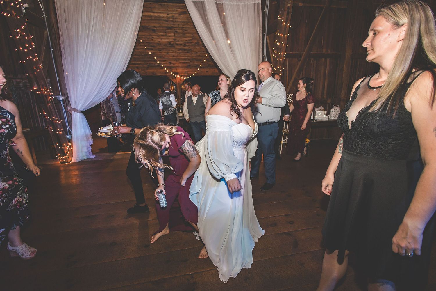 Wedding reception dance party in full swing with guests enjoying the festivities.