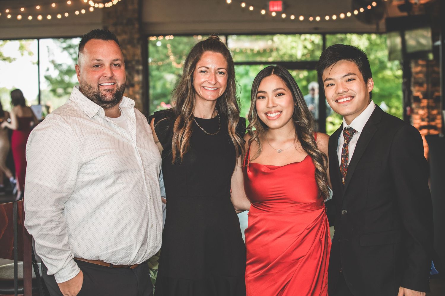 Reception celebration photos showing guests mingling under string lights.