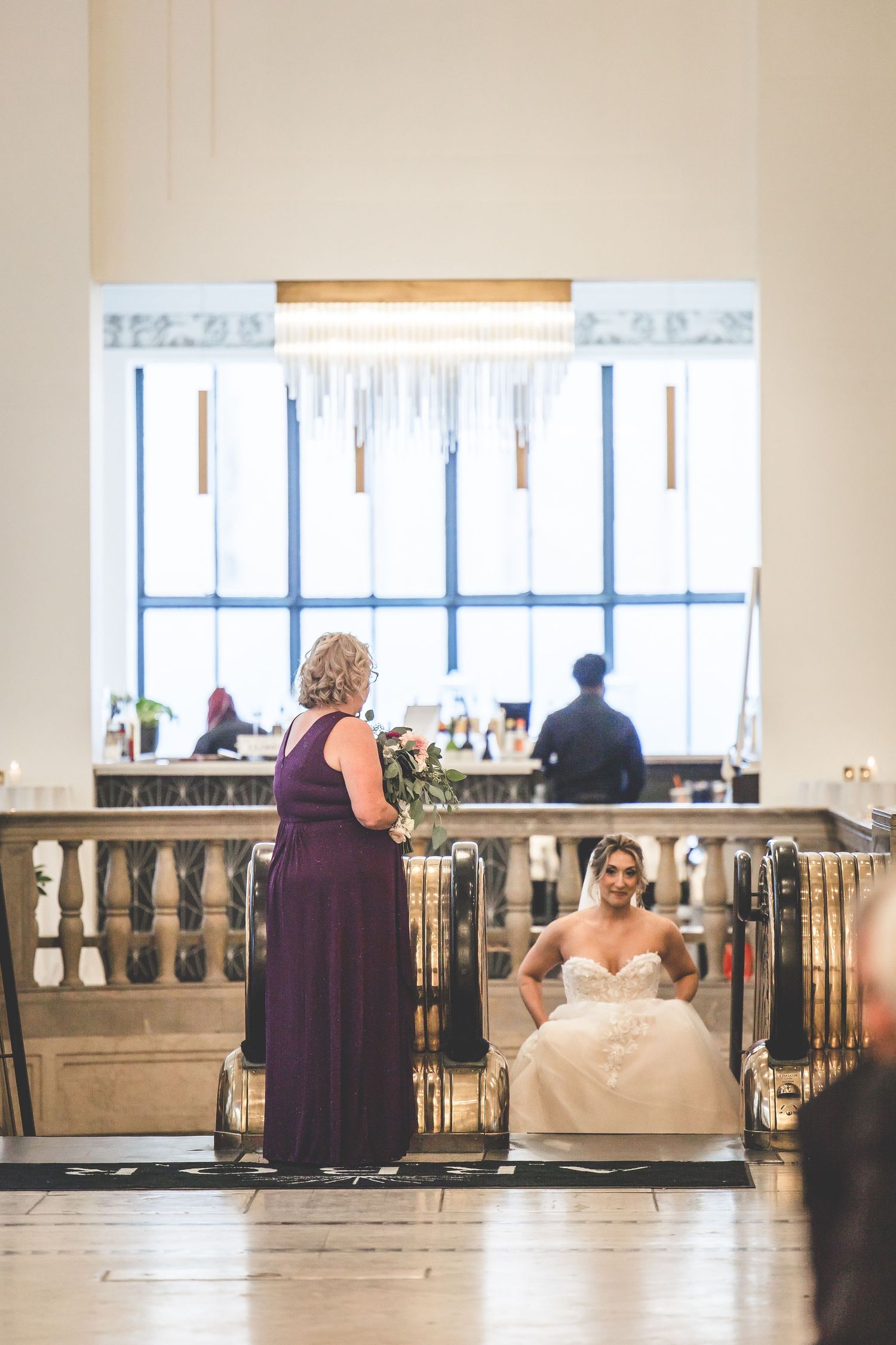 Wedding venue balcony overlooking windows with formal event seating.