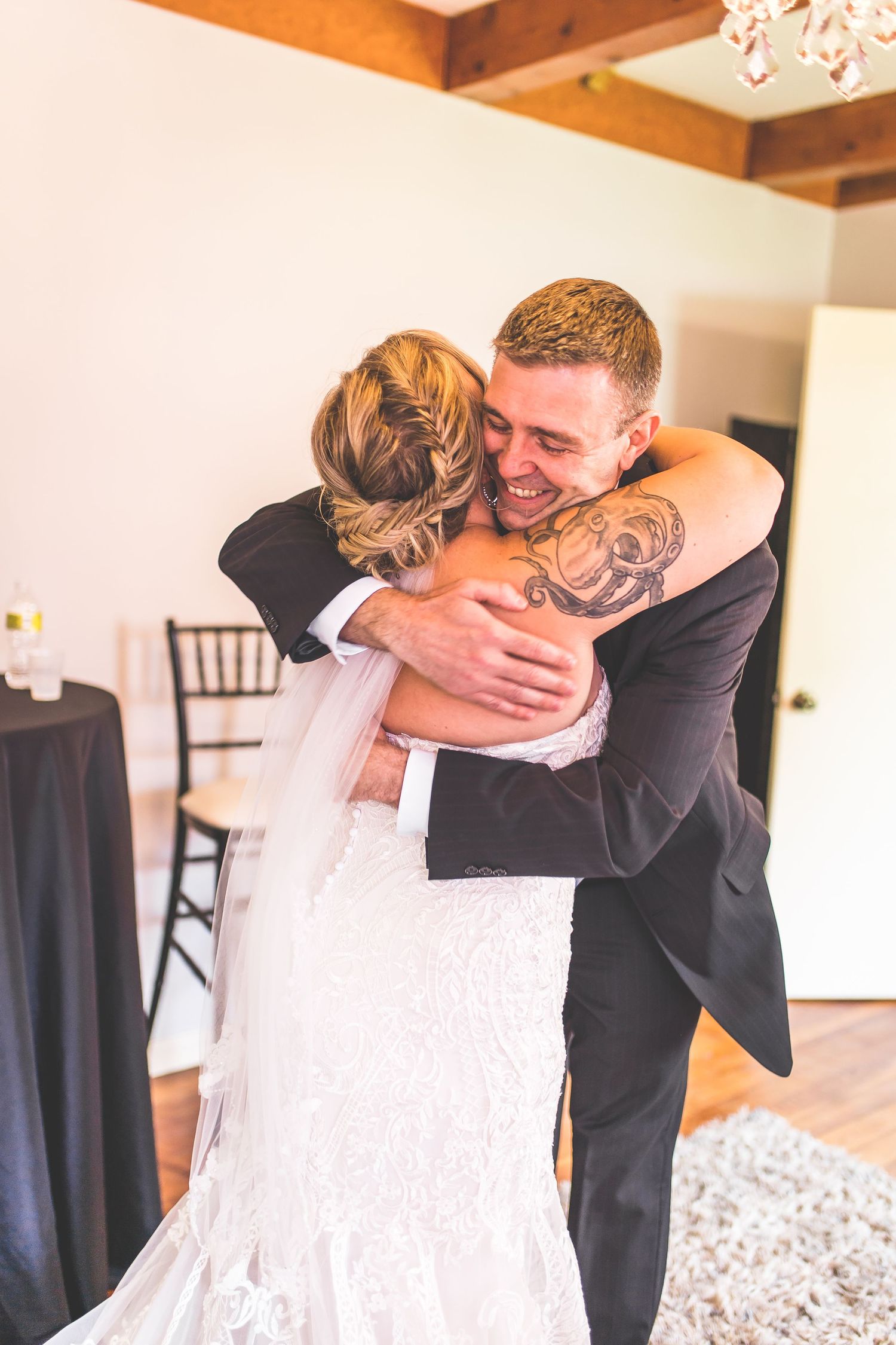 Emotional first look moment between couple in wedding attire.