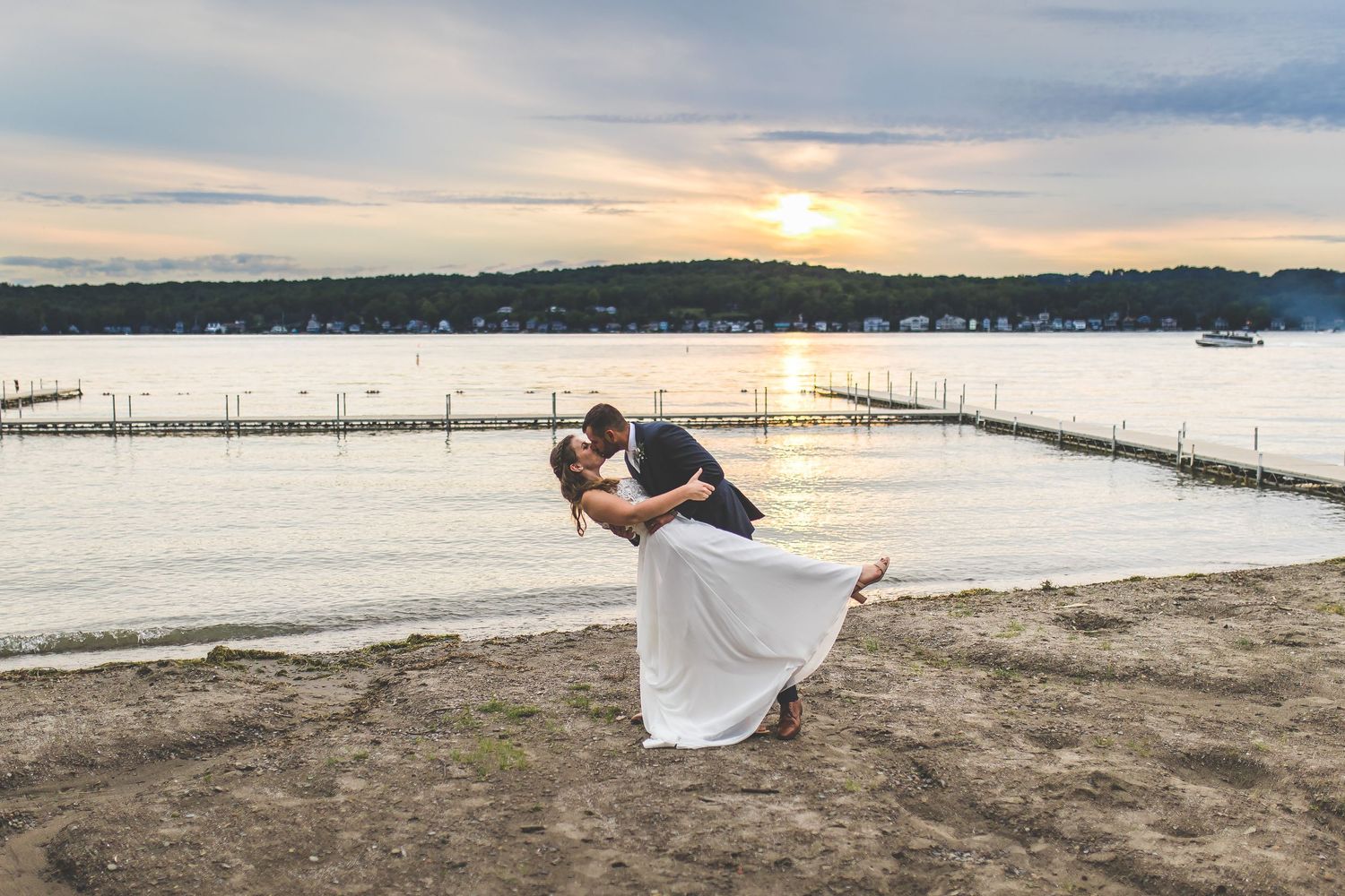 Romantic sunset beach wedding photos with pier and waterfront views.