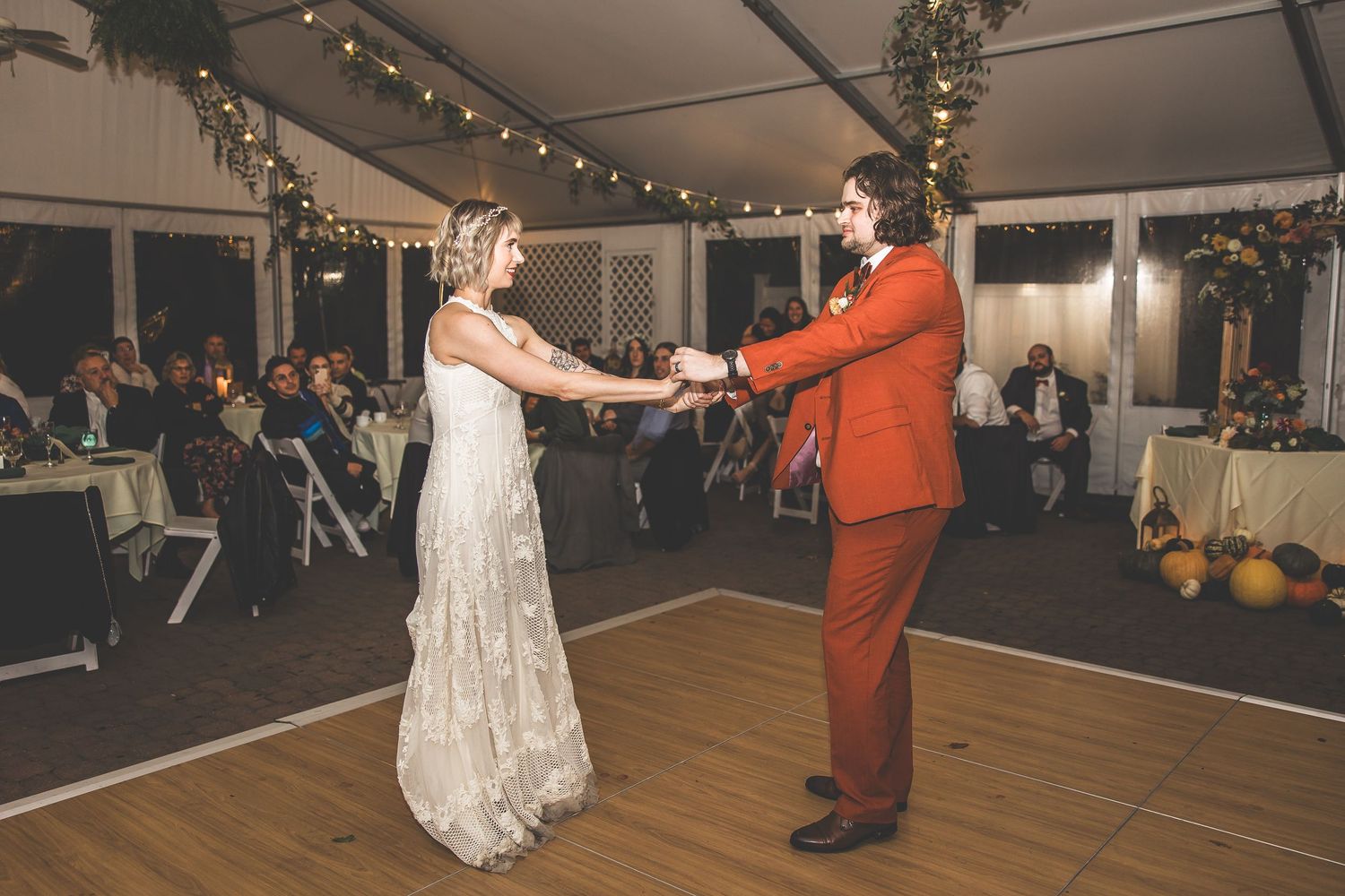 A lively dance sequence shows a couple twirling and spinning across a reception dance floor.