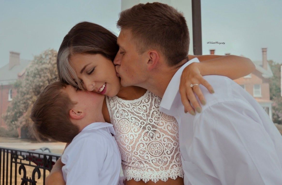 A couple shares a romantic moment together in a series of four intimate poses.
