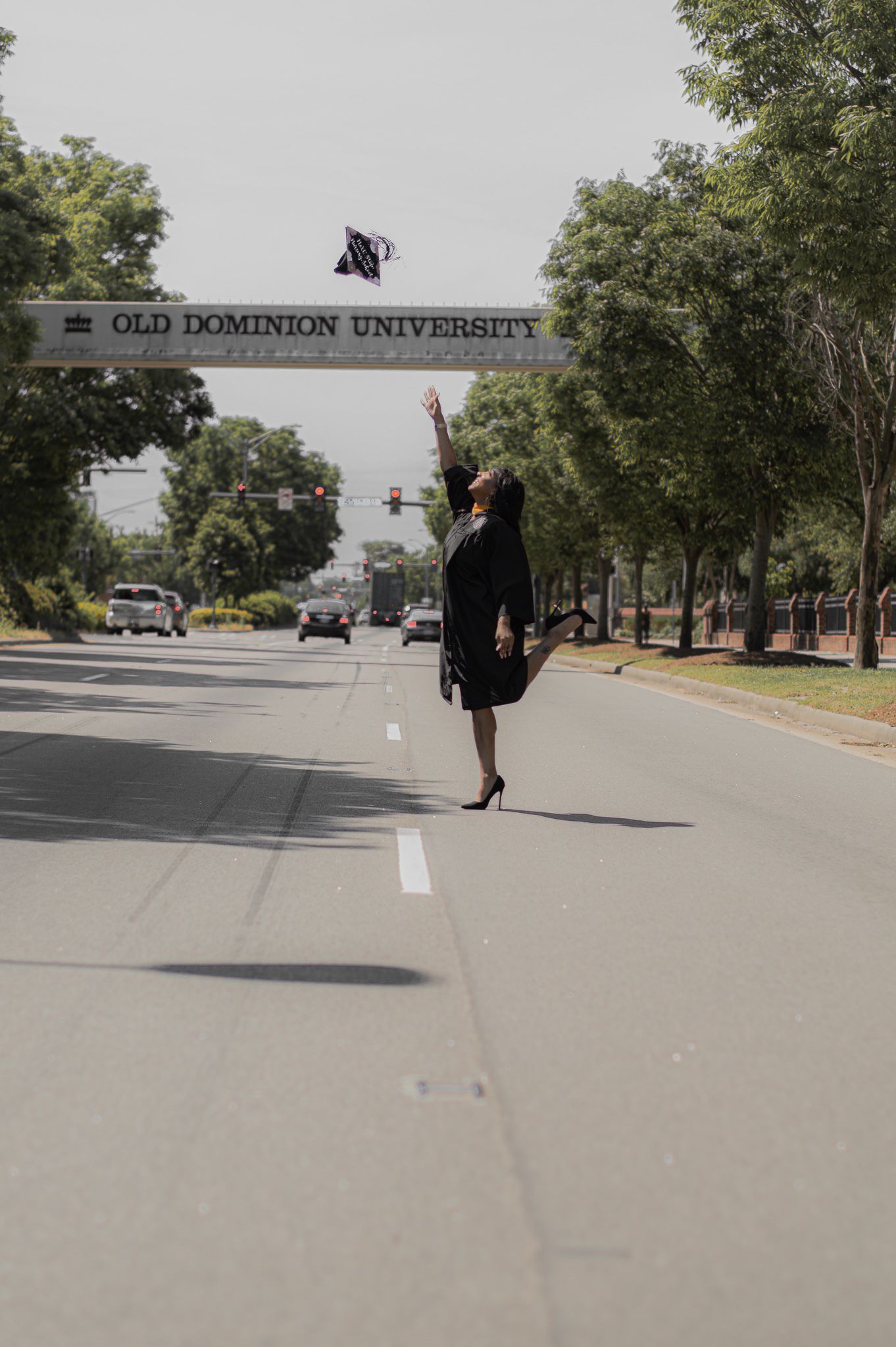 Empty campus road with Old Dominion University sign visible in the background.
