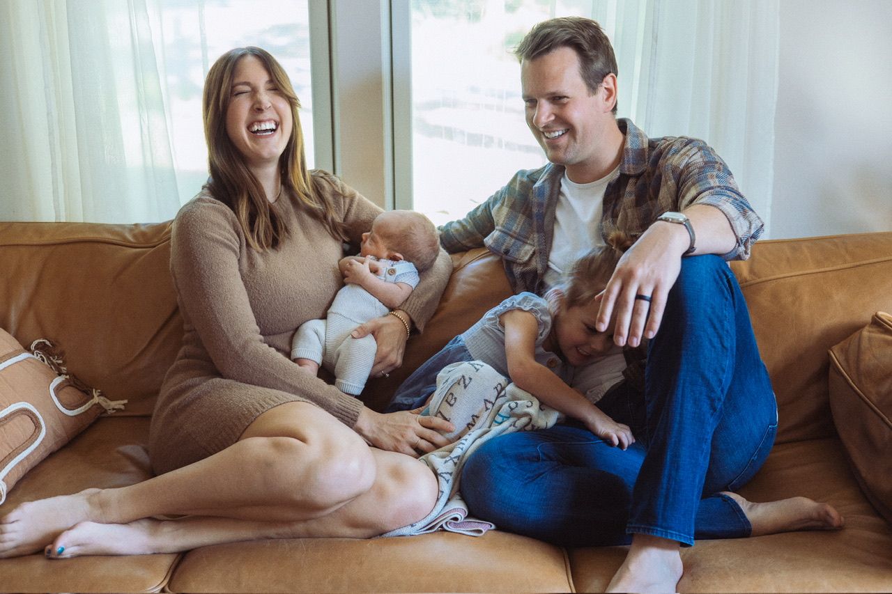 Candid lifestyle photos of family relaxing together on a couch indoors.