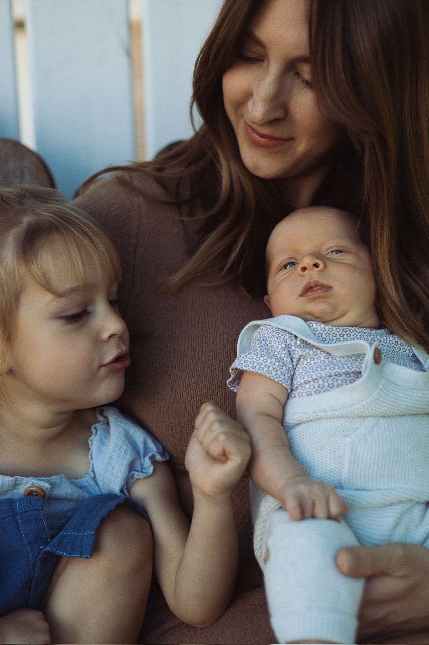 A series of tender moments between parent and child shown in five connected photos as they share loving embraces.