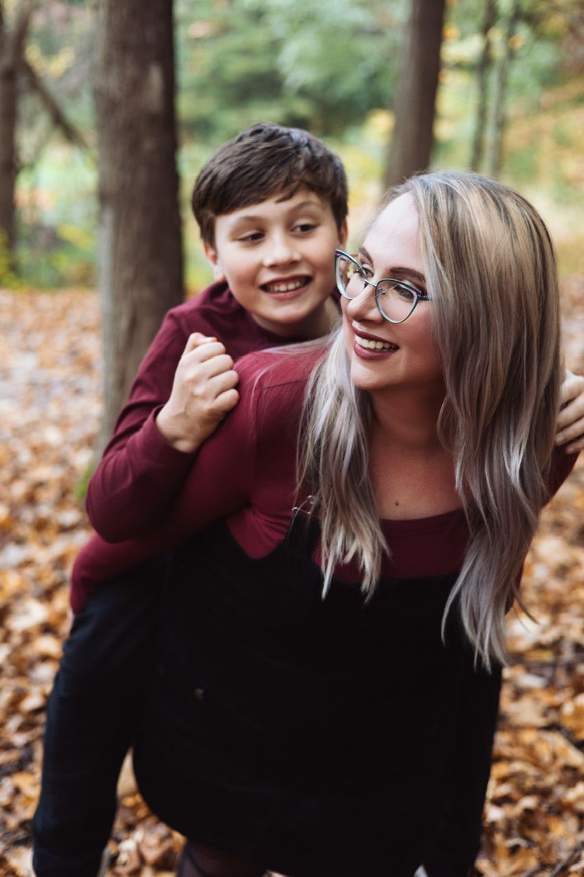 Candid sequence of joyful interactions between people outdoors among fallen autumn leaves.
