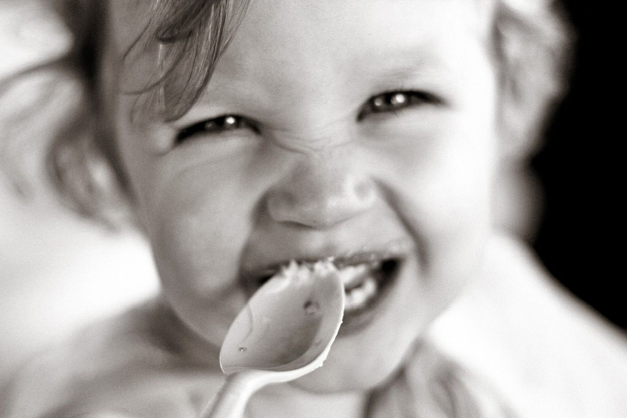 Black and white close-up expressions showing joy and laughter.