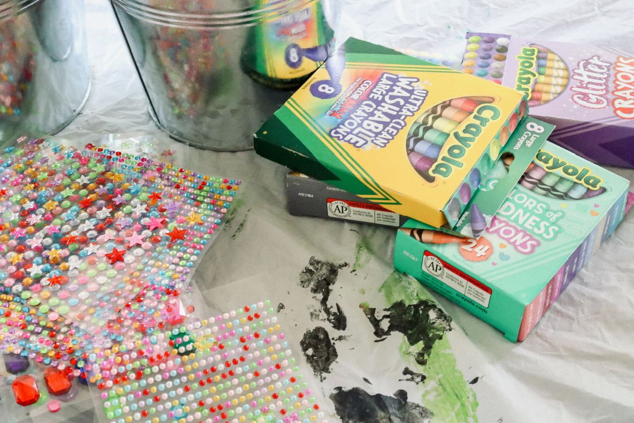 Colorful candies or beads scattered on a patterned surface.