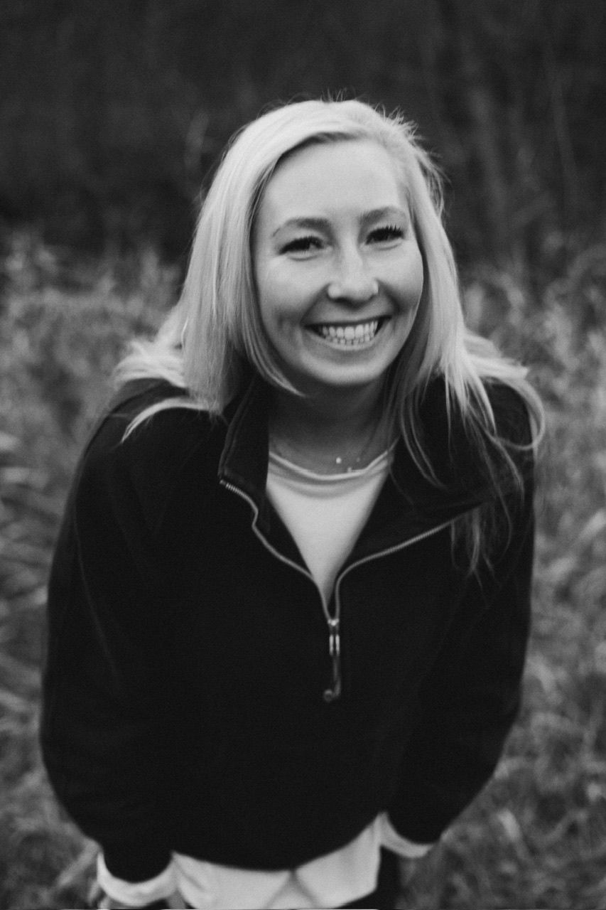 Black and white photo series showing a person in a dark jacket smiling outdoors in a natural setting.