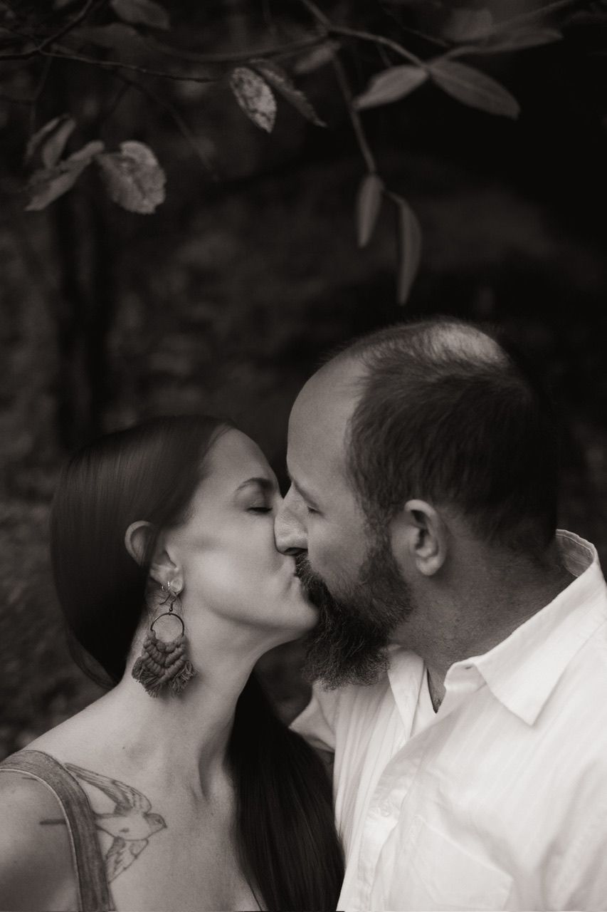 Intimate black and white romantic portrait in natural setting.