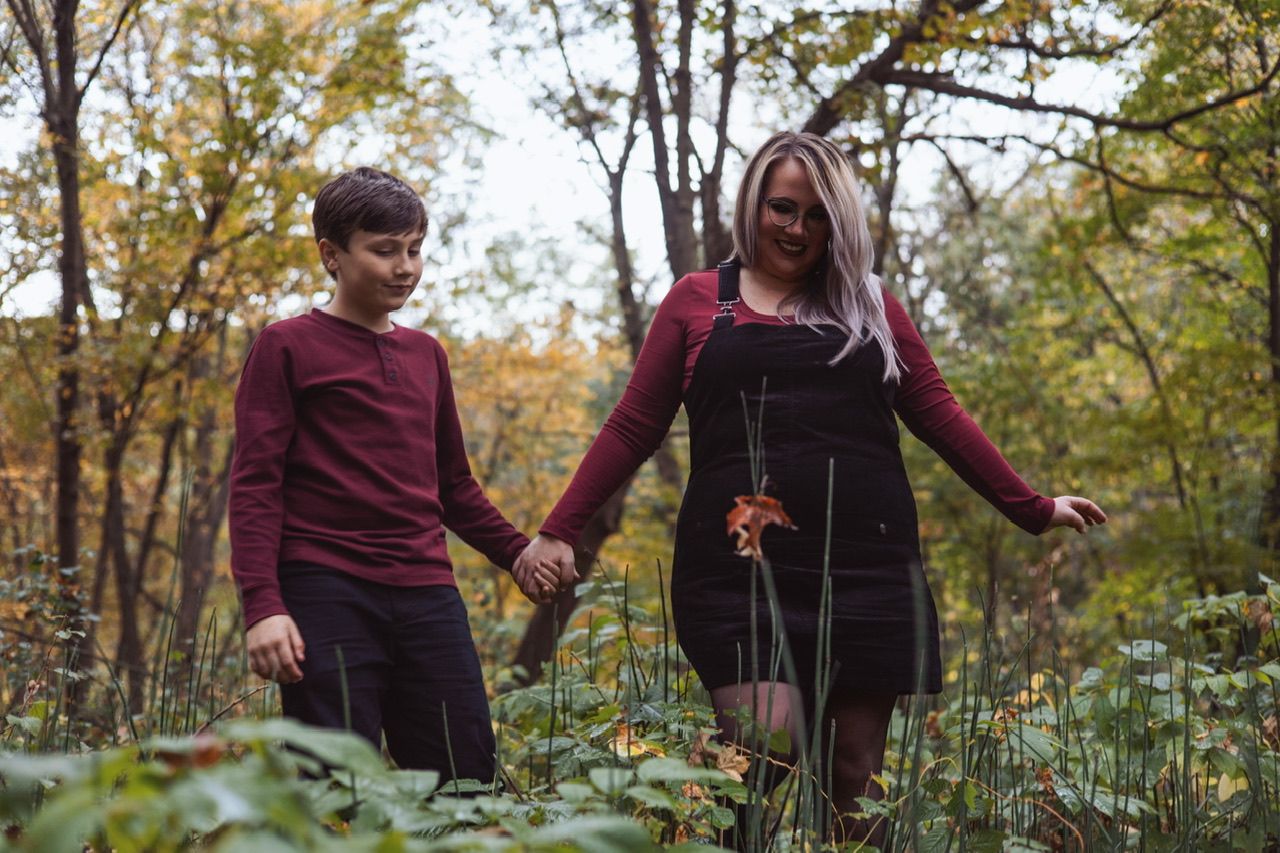 A playful autumn photo sequence showing people in burgundy and black clothing walking through fallen leaves.