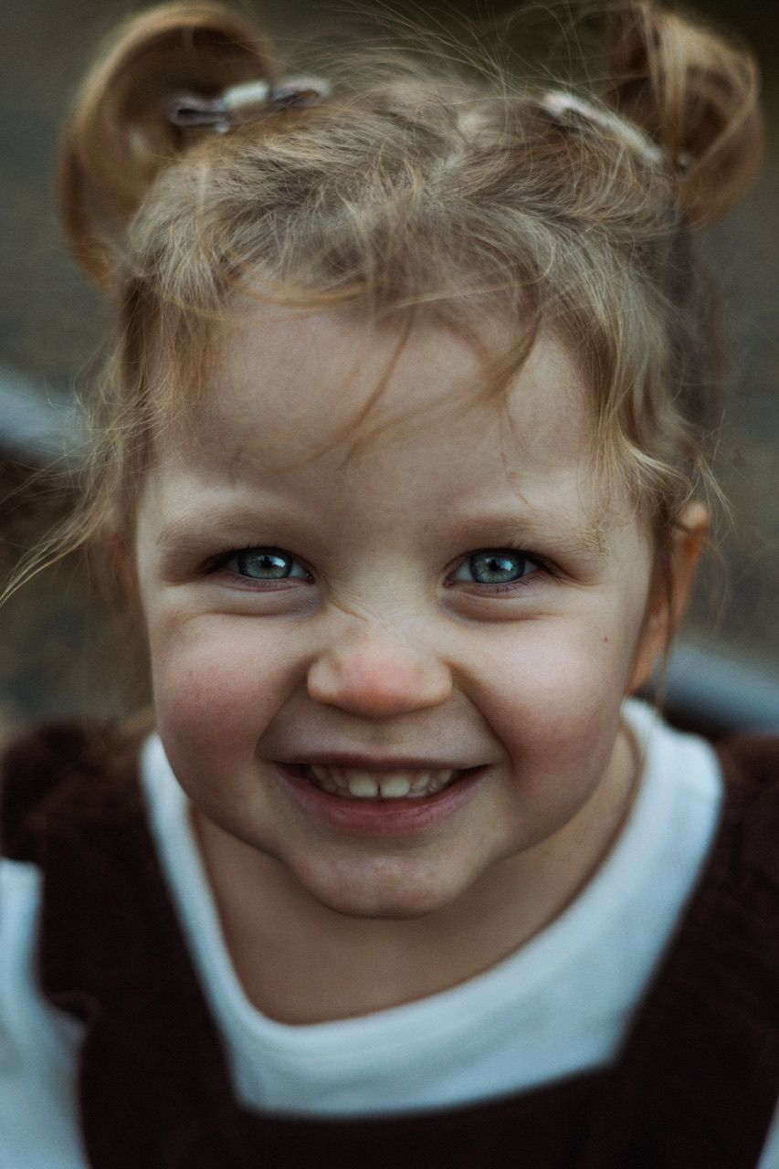 Close up portrait sequence showing playful expressions and bright blue eyes.