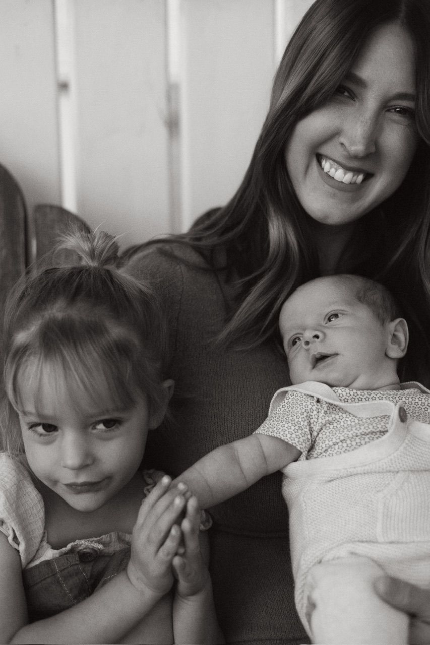 A series of black and white photos showing tender moments between a mother and child in casual settings.