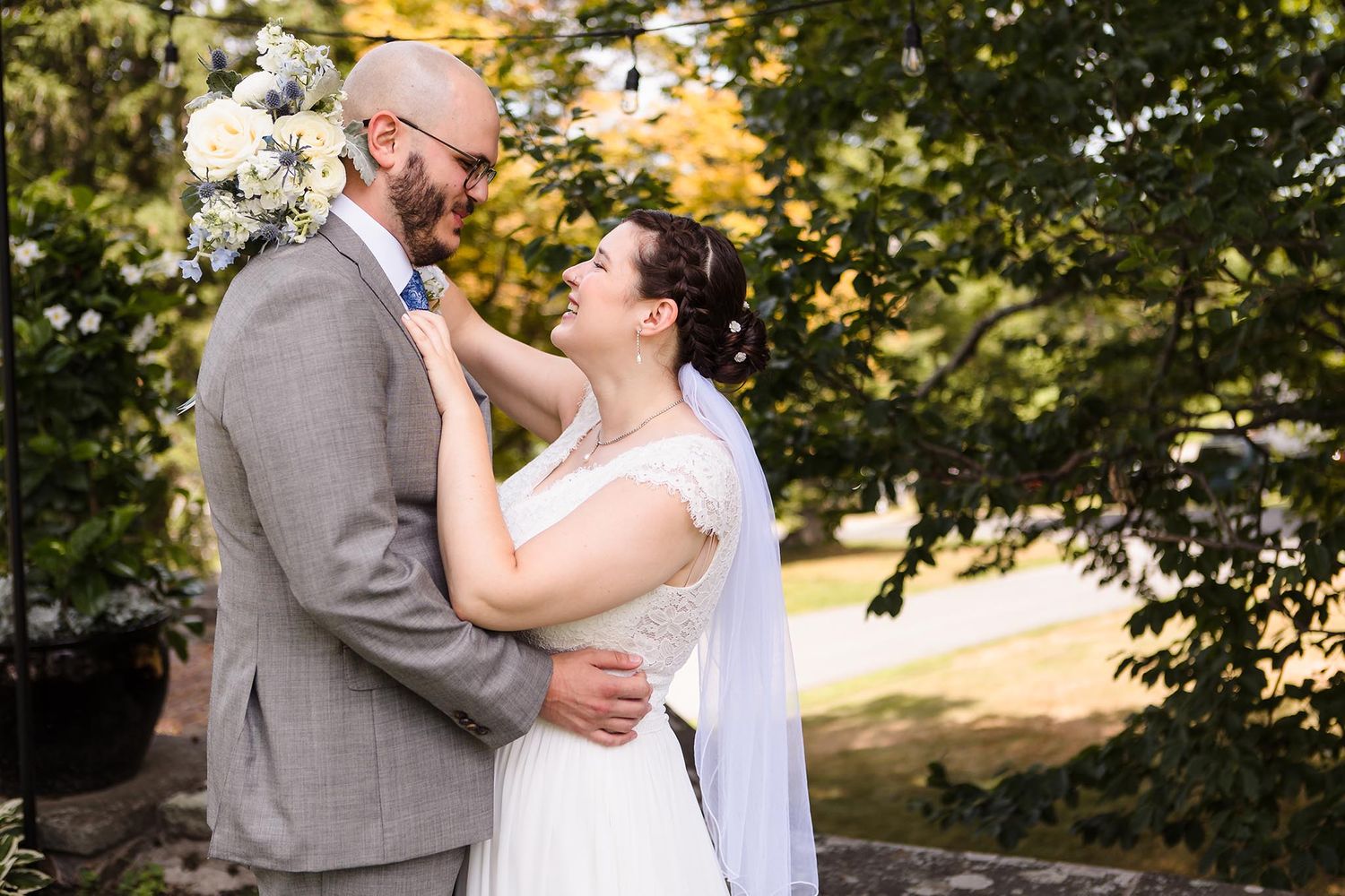 On a sunny summer day, the bride and groom embrace for a romantic Portrait.
