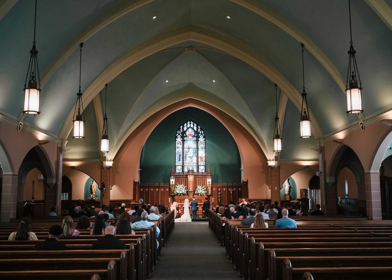 Wide angle photography of the interior Saint Brigid Church in South Boston