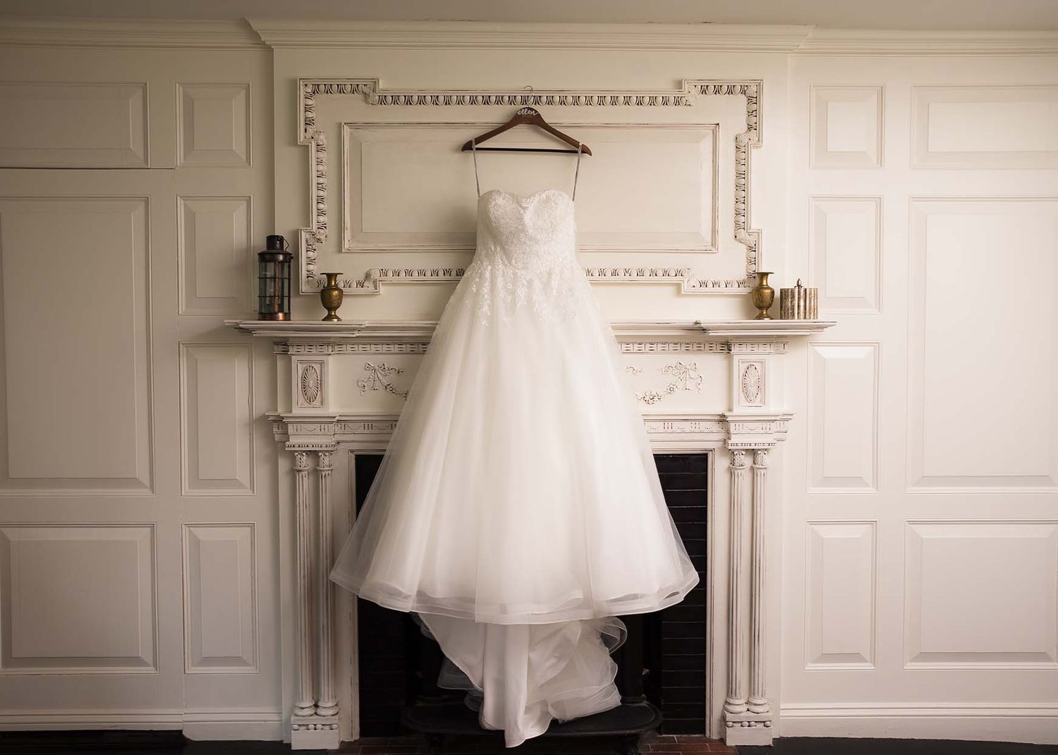 An old fashioned fire place is an excellent location for an image of the wedding dress.