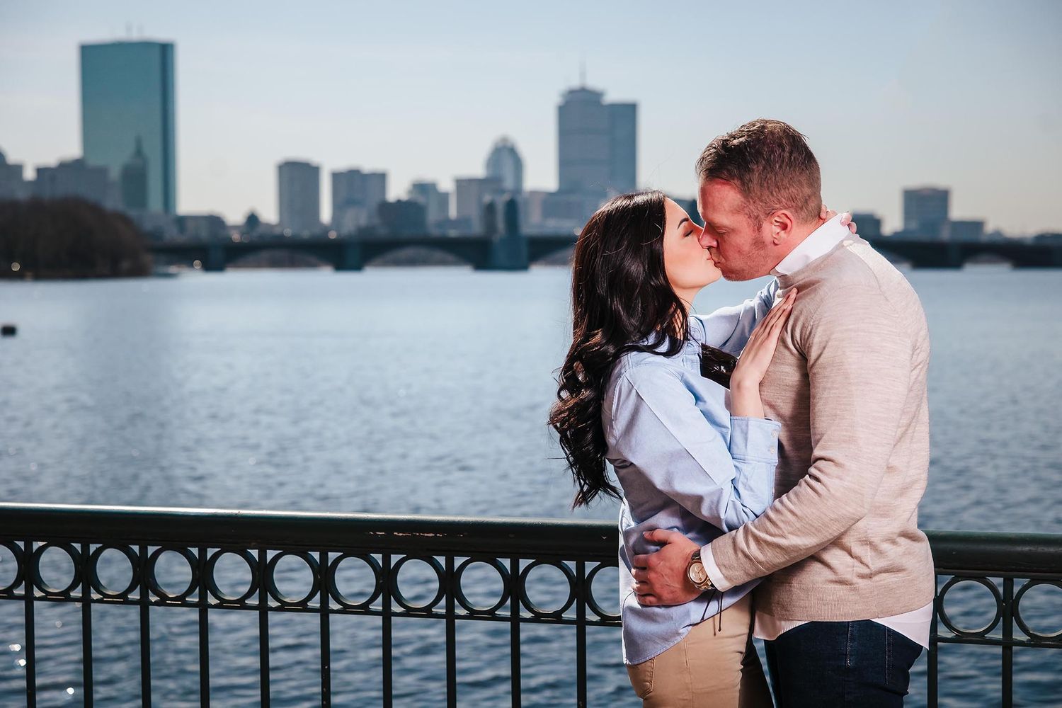The  bride and groom share a passionate kiss during their engagement session at the Boston Museum of Science with the Ch
