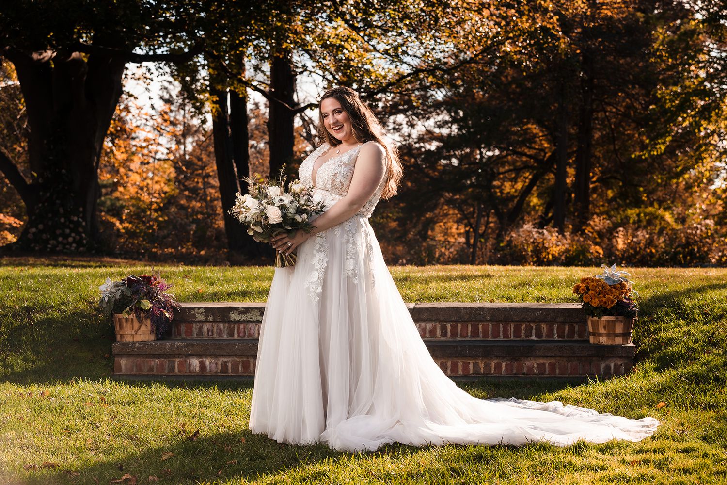 A very happy bride smiles for a portrait on the lawn at Peirce Farm Witch Hill