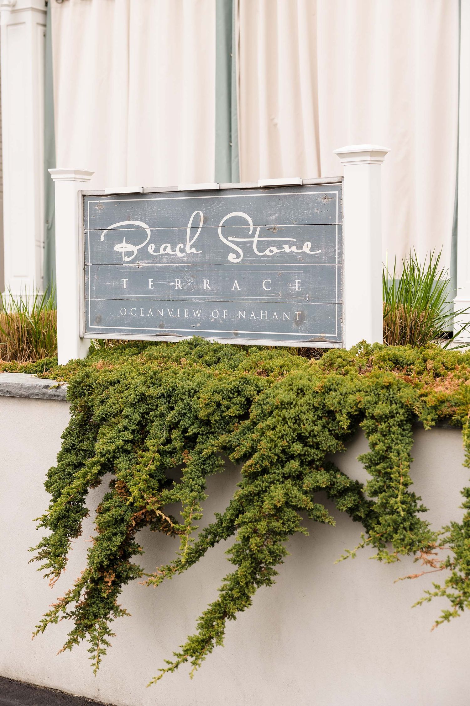 Sign for the beach stone terrace which is the tent directly next to the Oceanview of Nahant.