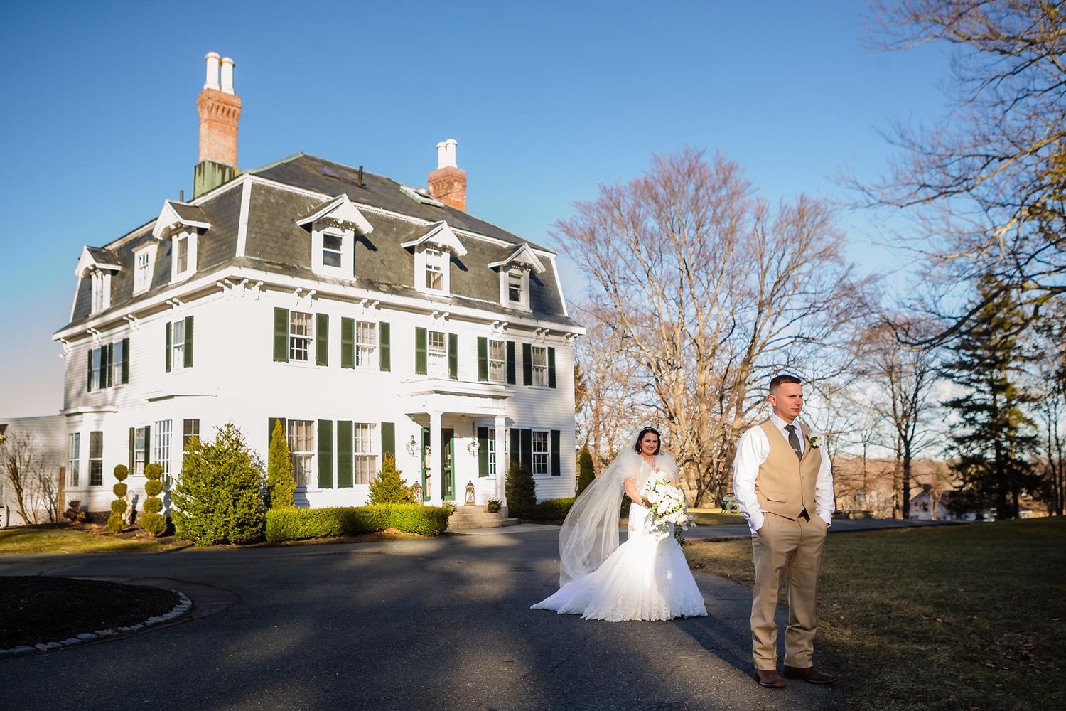 The groom eagerly awaits his first look with is bride to be on the lawn at Peirce Farm Witch Hill