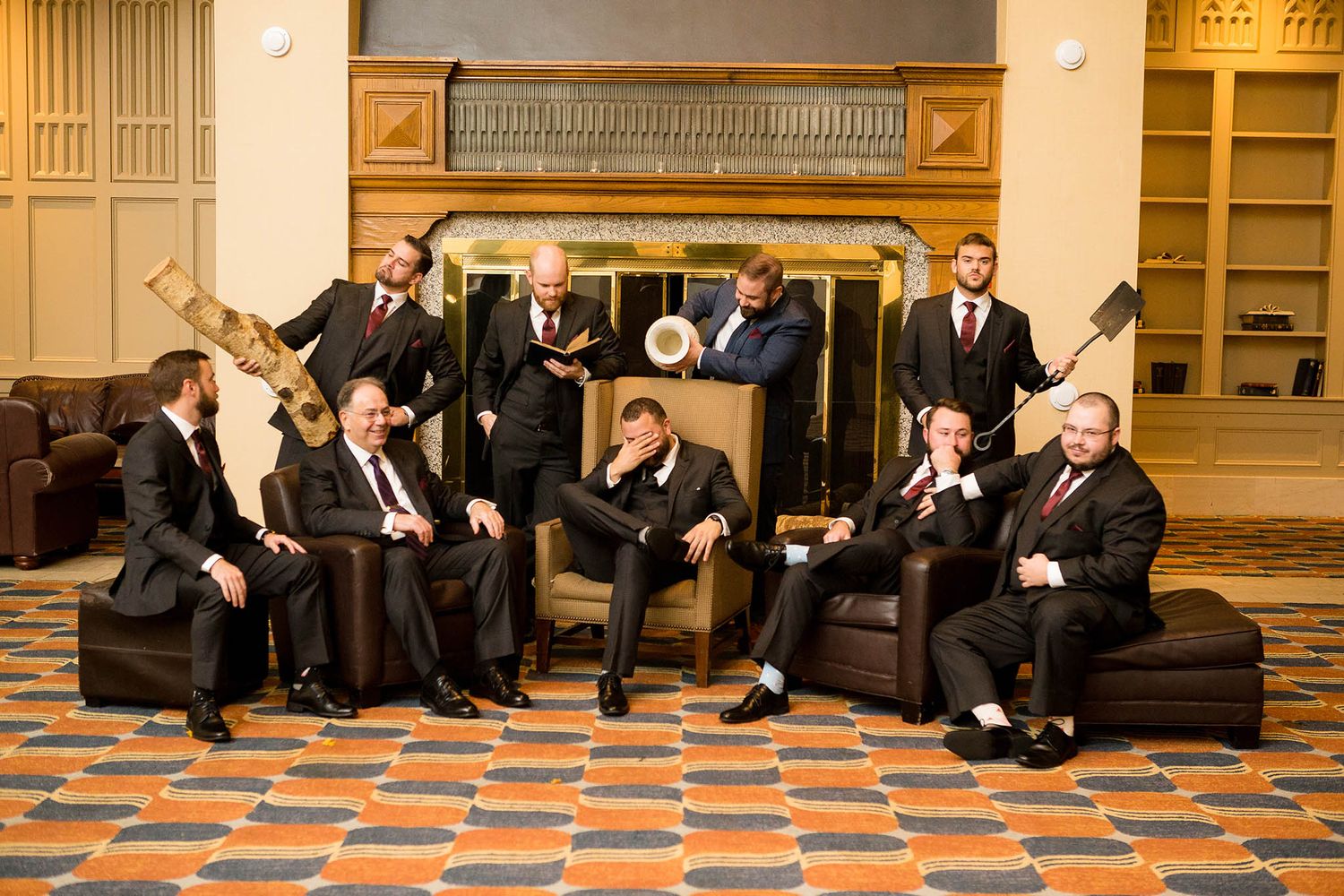 Groomsmen pose for a funny goofy portrait.