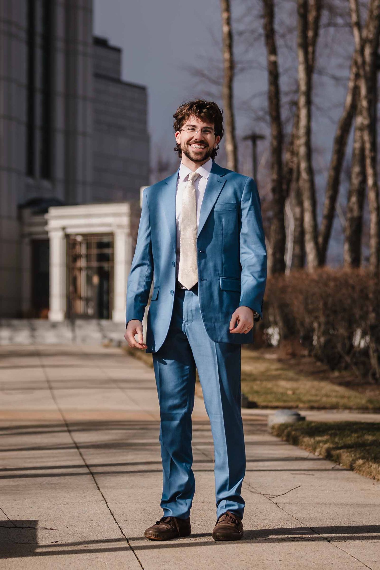 The groom smiling after seeing his bride for the first time in her wedding dress.  Elopement at Boston Massachusetts Temple, Belmont, MA