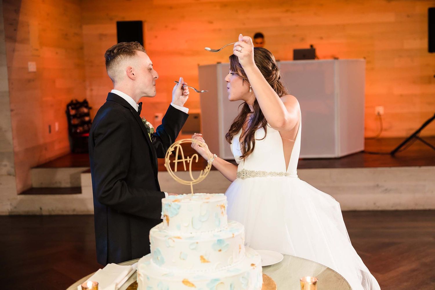 THe bride expresses just how good the wedding cakes tastes.