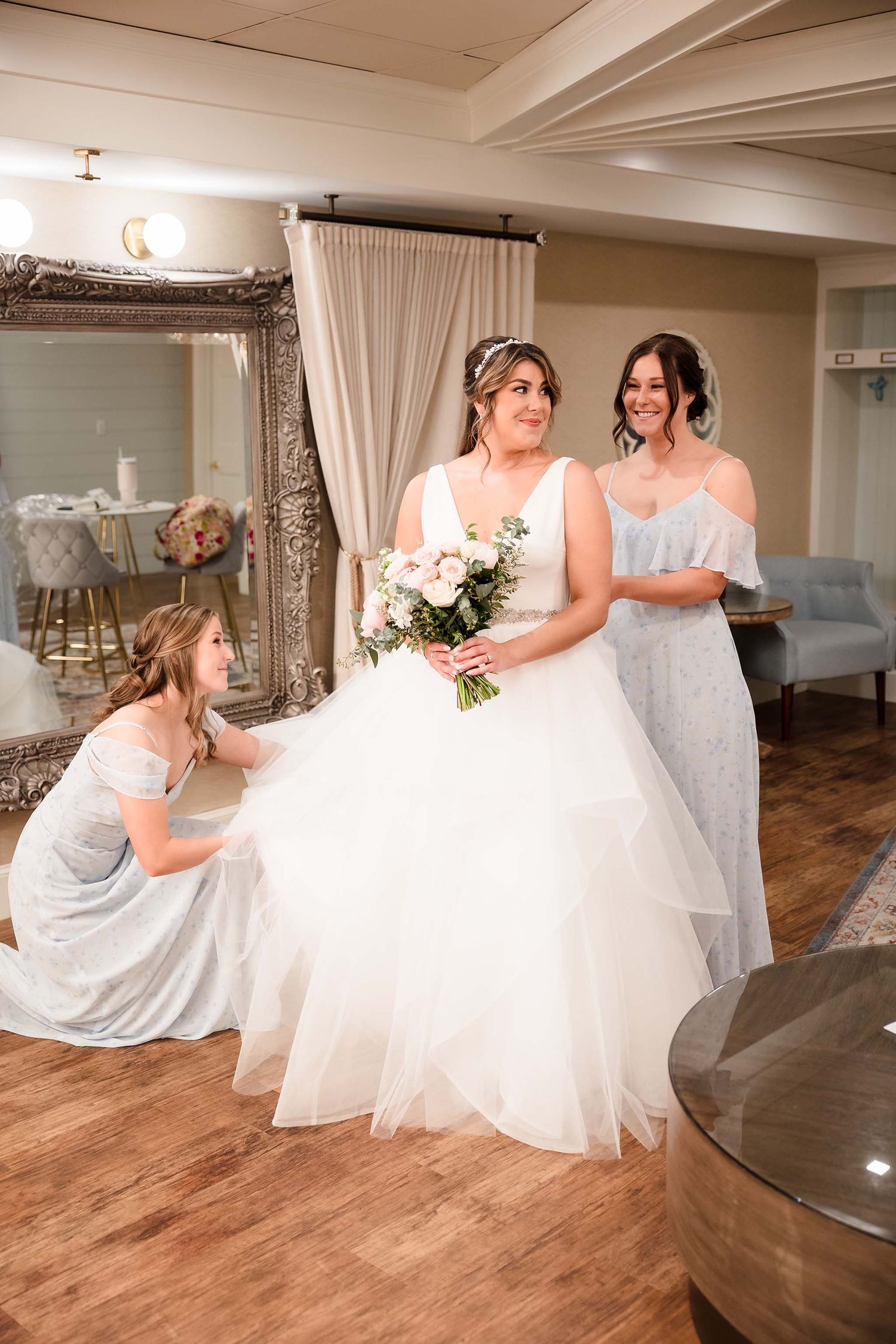 THe bride and her bridesmaids take a moment to enjoy the pre ceremony.