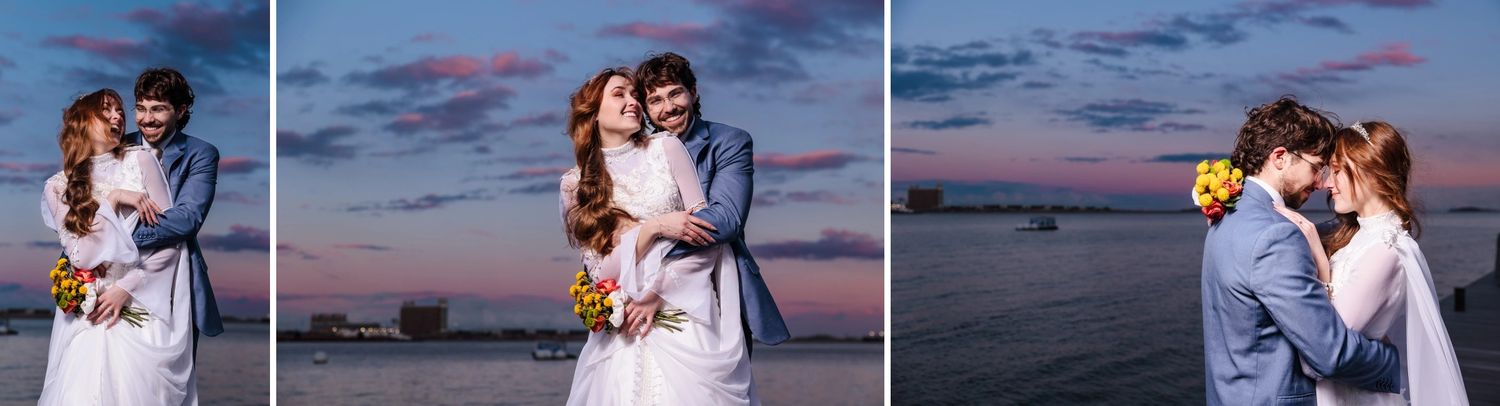 The newly married bride and groom hug, giggle, and kiss in front of a colorful sunset at Boston's Fan Pier Park for their Elopement session.