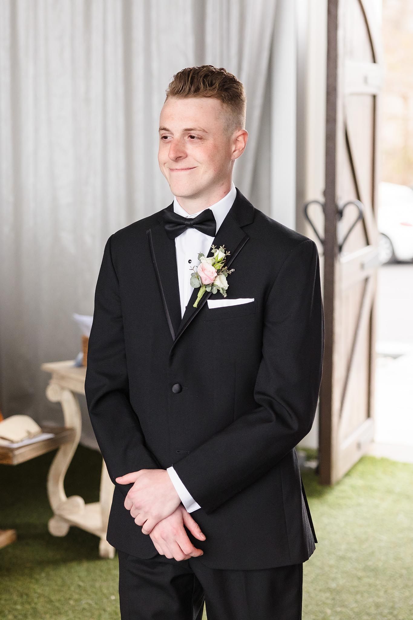 THe groom walks eagerly down the aisle to start the wedding processional.