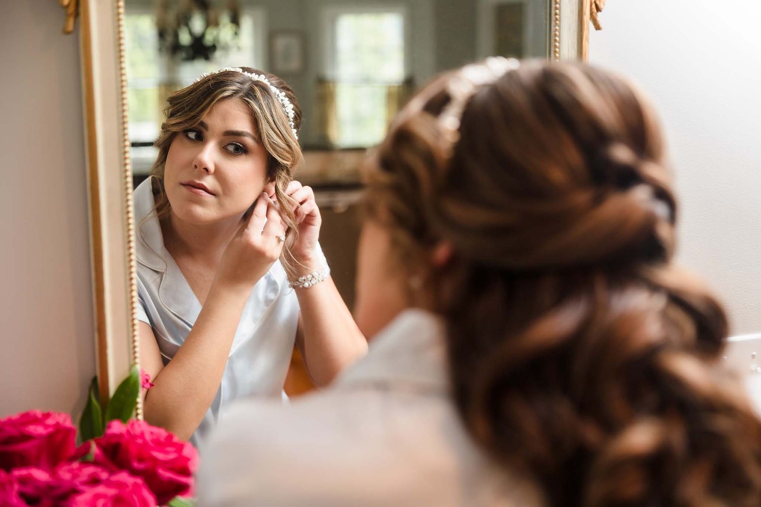 The bride puts her ear rings in right before she puts on her dress.
