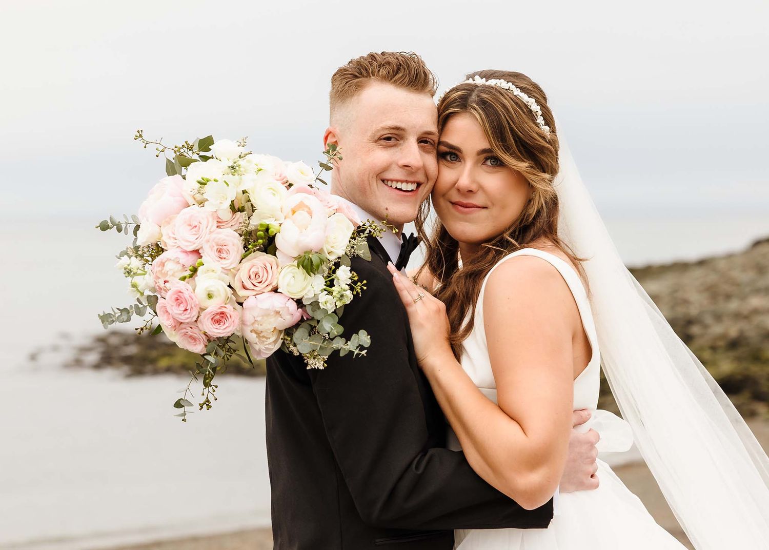 Romantic portrait of the bride and groom right after their wedding ceremony