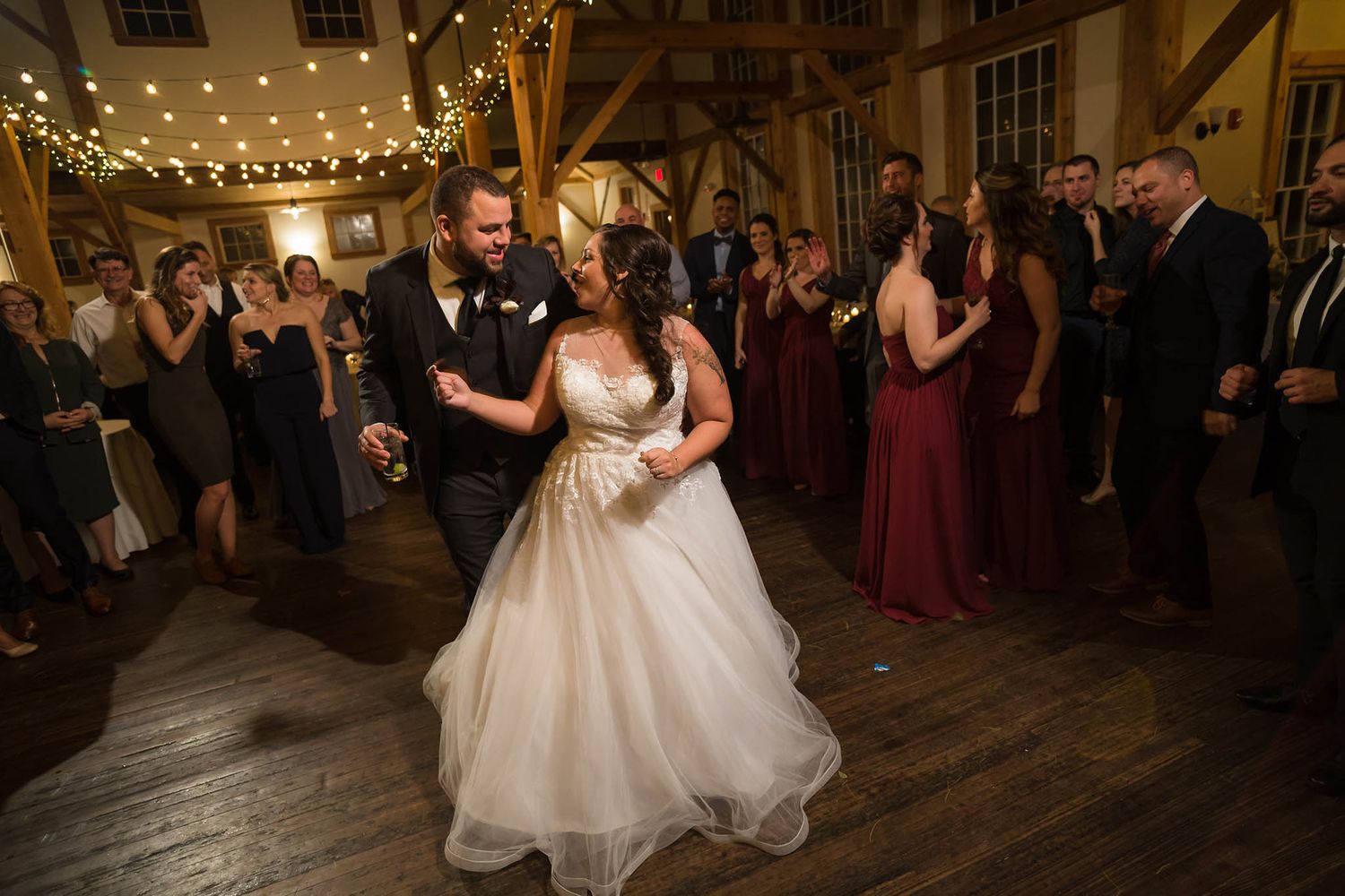 The dance floor has officially opened and the bride and groom bust a move!