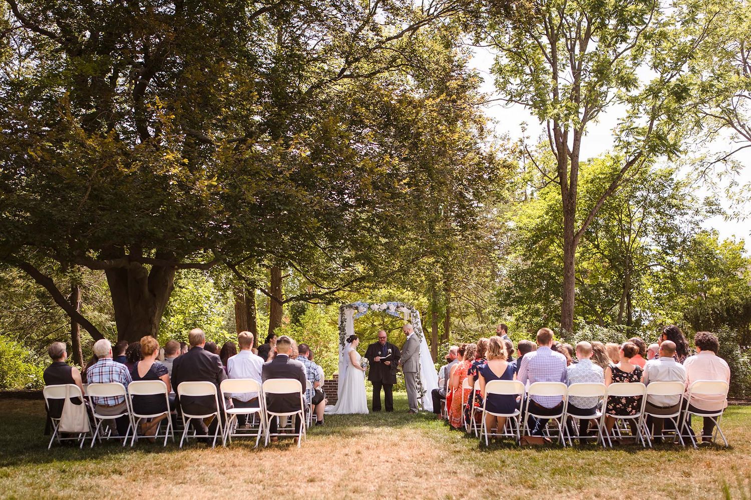 A sunny afternoon wedding ceremony outdoors at Peirce Farm Witch Hill