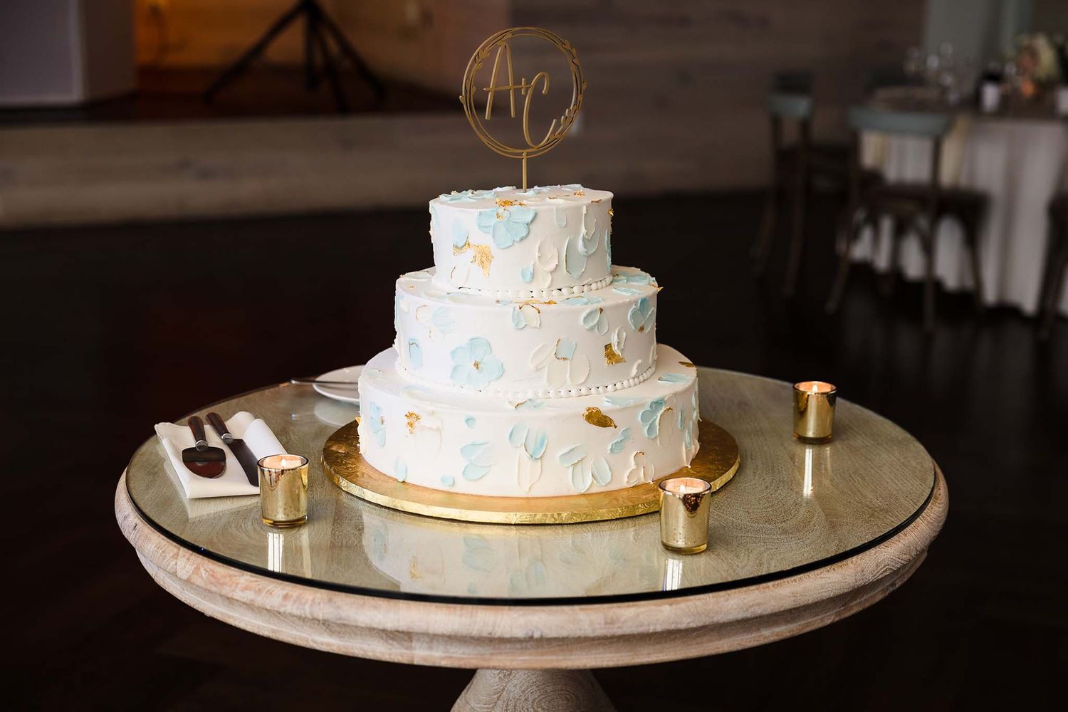 The custom designed wedding cake is all ready for the bride and the room.