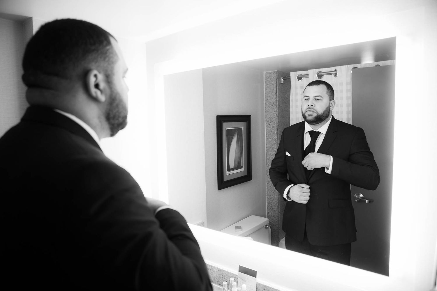 Groom gets dressed before the wedding.