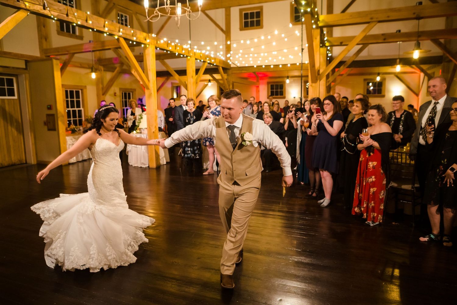 The bride and groom do a dramatic first dance at the start of their wedding reception at Peirce Farm