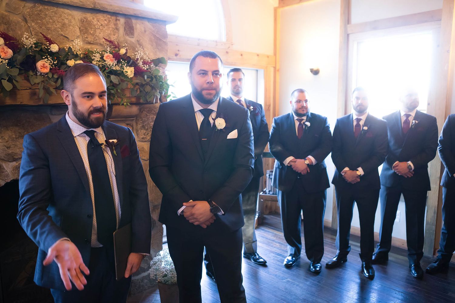 At the start of the wedding ceremony, the groom nervously awaits his bride.