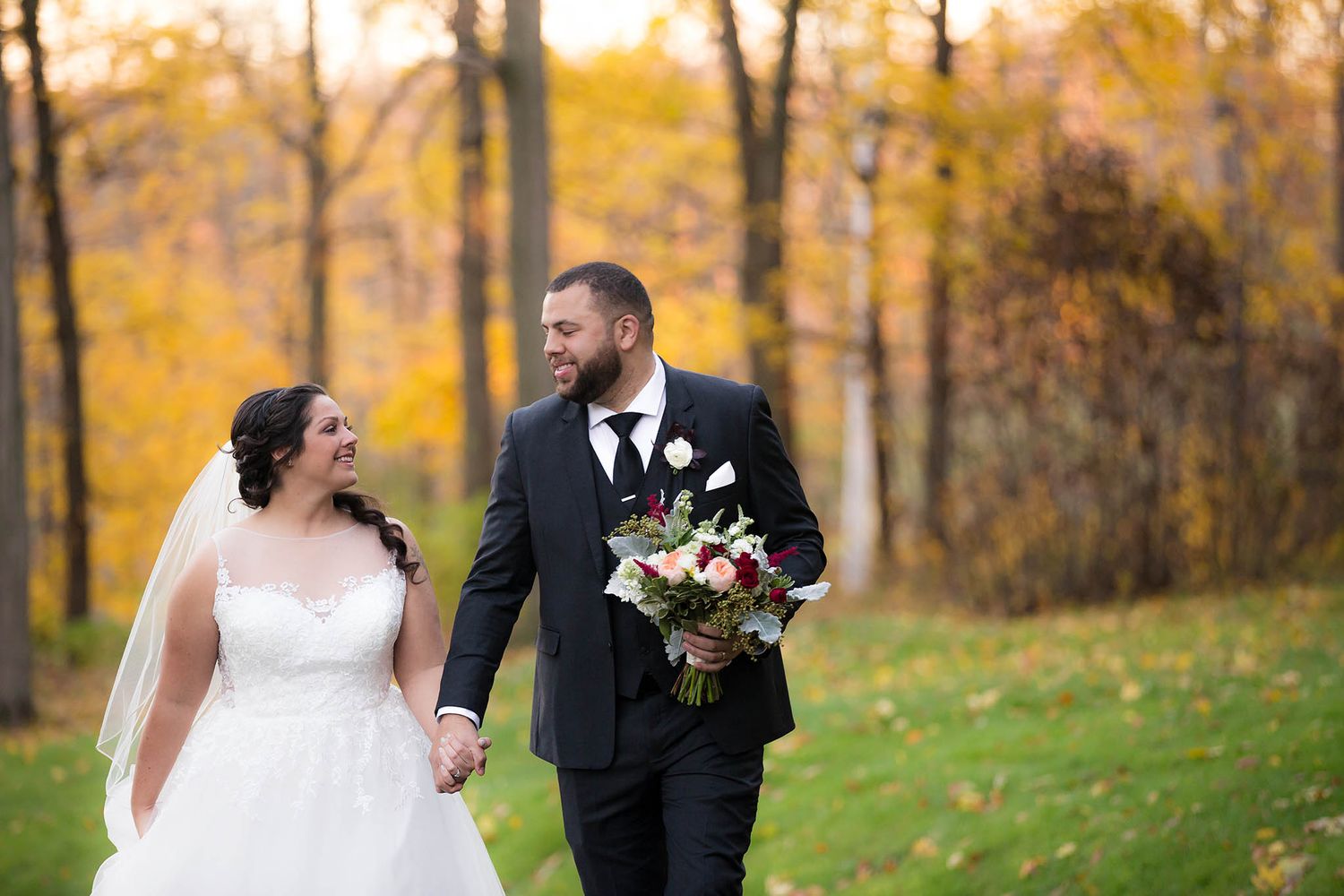 The bride and groom take scroll for pictures around the grounds of Peirce Farm