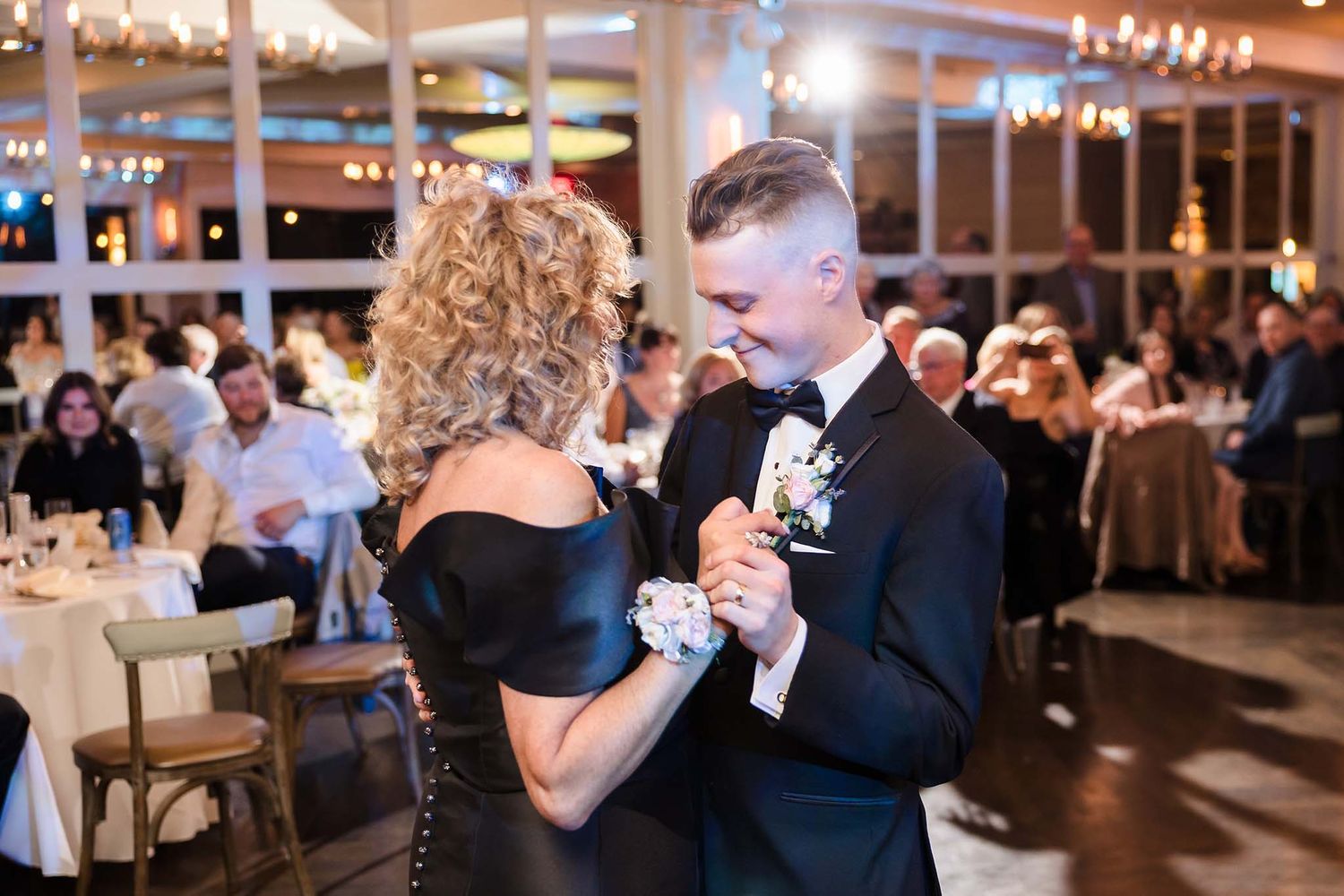 Groom and his mother enjoy a moment together.