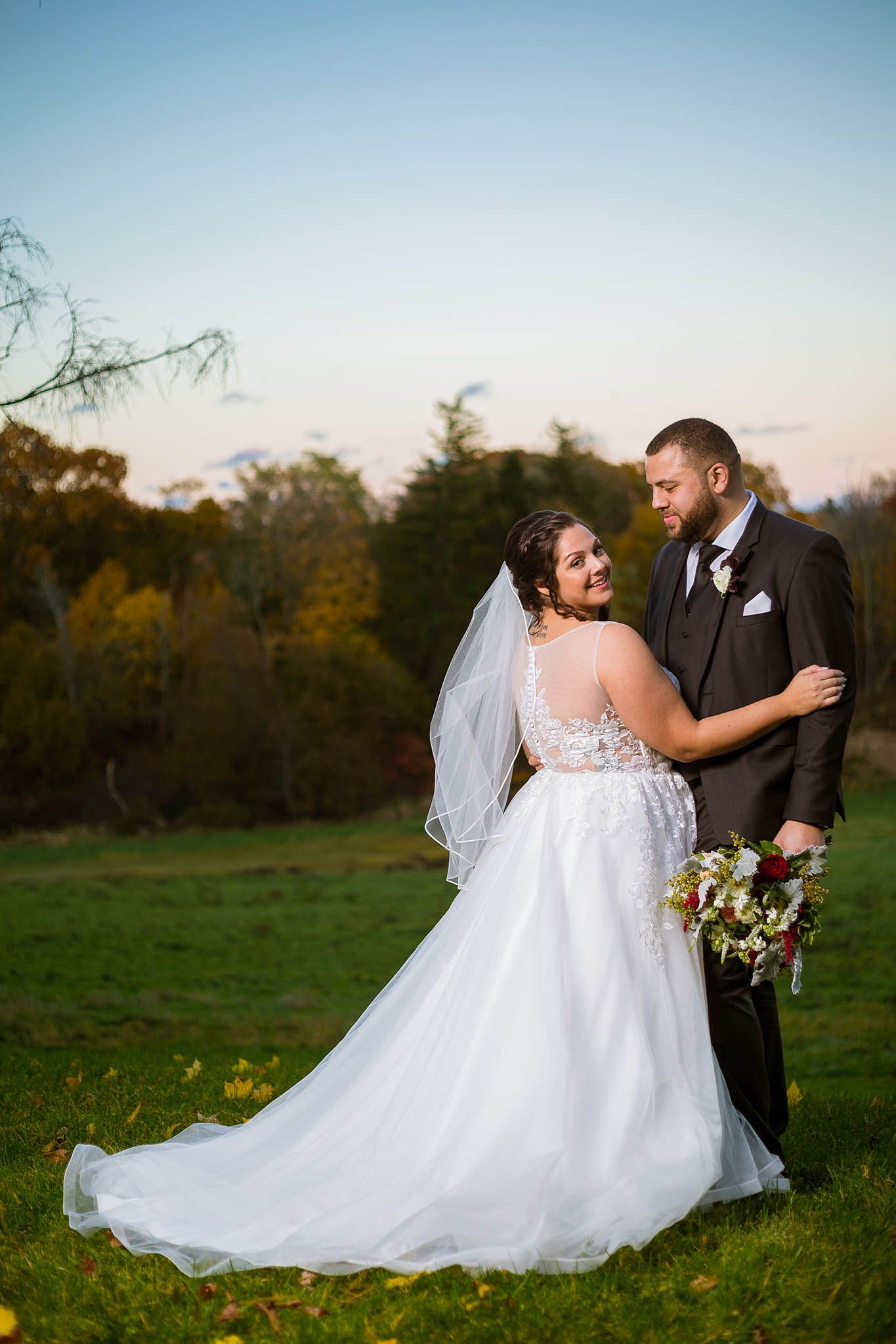 A compelling portrait of the bride and groom looking at each other.