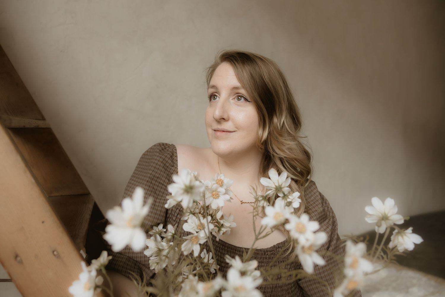 A series of artistic portraits featuring white flowers and soft lighting in a romantic, ethereal style.