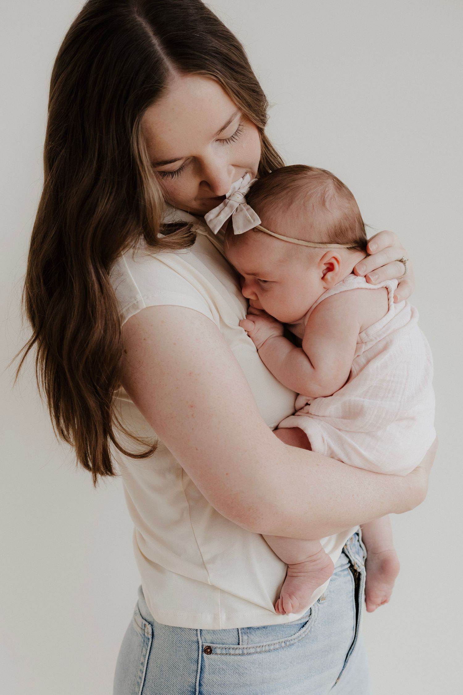 Mom hugging her child during a family photo session