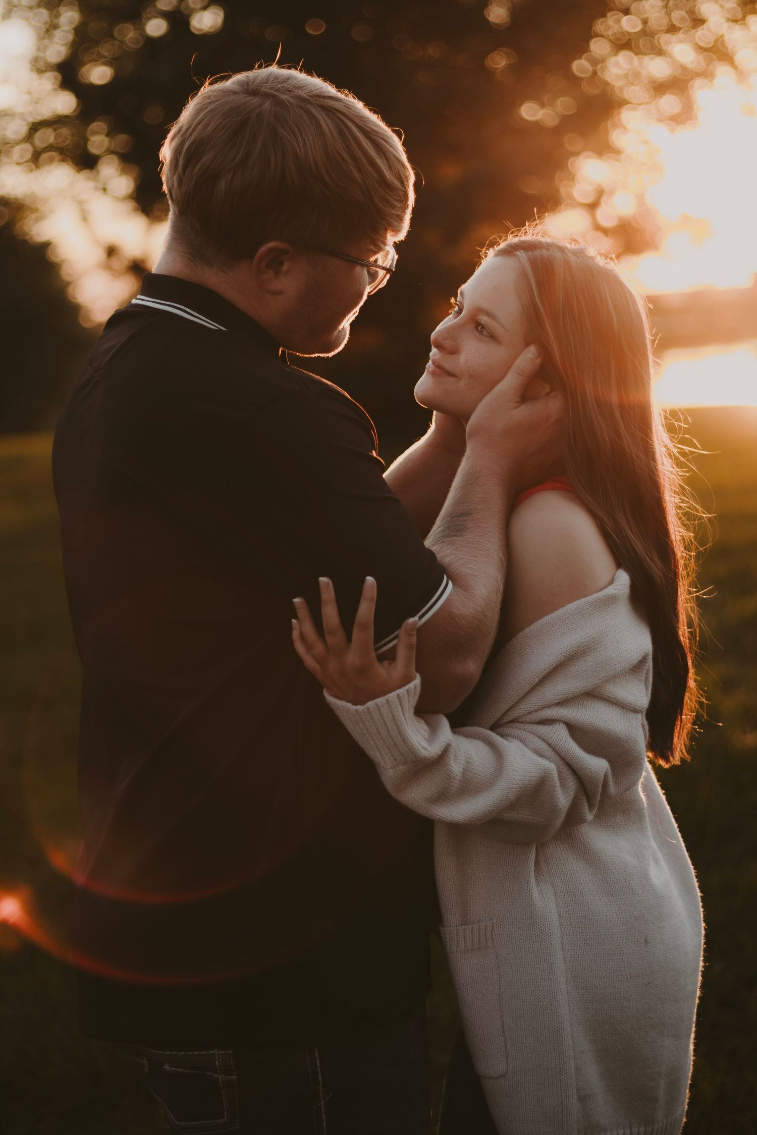 Couple gazing at each outher during an outdoor  golden hour photography session
